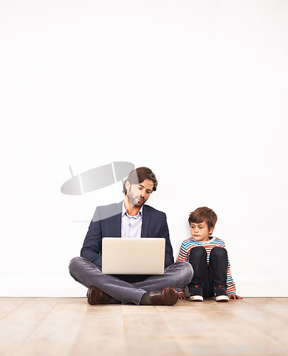 Image of Businessman, son and relax on floor with laptop for remote work with video streaming, online games or movies in home. Family, father or kid with technology on ground for bonding, communication or fun