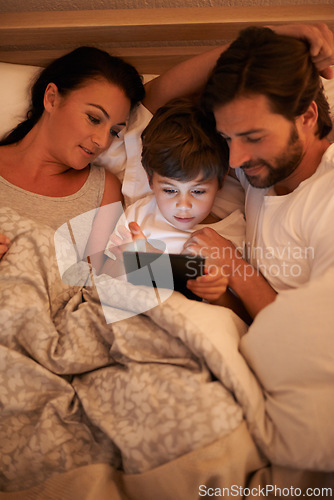 Image of Parents, watch and boy with tablet in bedroom for movie, digital and educational for learning of child. Family, love and technology with connection to internet for bonding, mom and dad relax with son