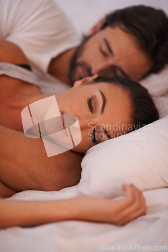 Image of Couple, sleeping and bed for comfort in house, peace and man together with woman in bedroom. Marriage, love and partners hugging for romance with care, relax and pyjamas to rest in home to dream