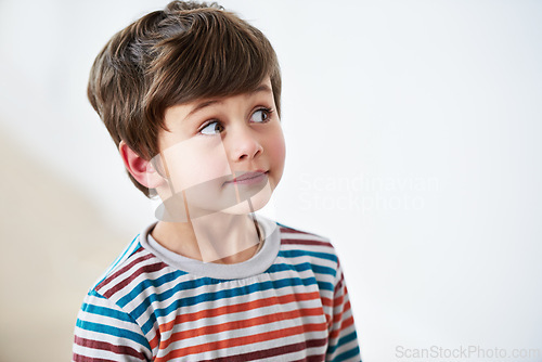 Image of Face, kid and boy thinking, idea and remember memory isolated on a white studio background mockup space. Vision, problem solving and young child with choice, planning and decision making for solution