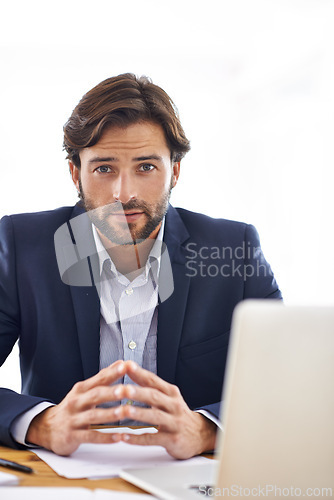 Image of Investor, portrait and businessman on laptop in office with project and research on stocks. Investment, review and planning on computer with email, communication or analysis of information on website