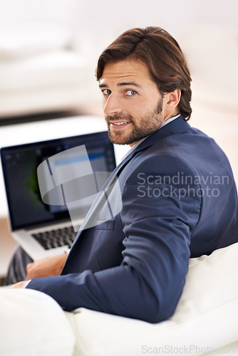 Image of Business, man and smile at home with laptop on couch, remote work, small business and confidence in suit. Sofa, lounge and professional with online for startup in positivity, formal and happy.