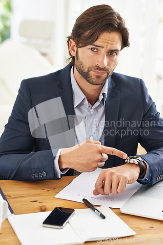 Image of Late, businessman and pointing to watch in office with appointment on schedule or agenda. Busy, entrepreneur and frustrated by delay in time with clock and planning timeline for day with wristwatch