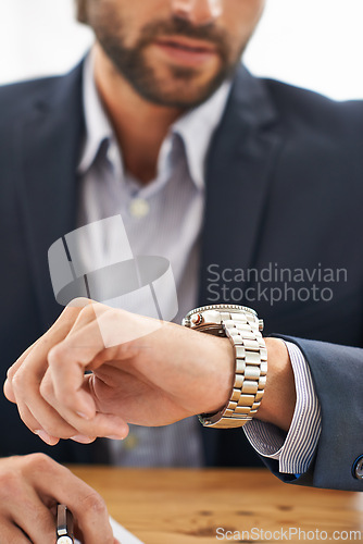 Image of Man, hands and wristwatch to check time for deadline at office, desk and schedule for business. Closeup, corporate and appointment for work with commitment, professional and plan for meeting.