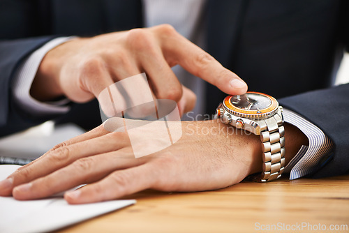 Image of Businessman, closeup and pointing to watch on hand with reminder of appointment on schedule or agenda. Busy, entrepreneur and check the time on clock and planning timeline for day with wristwatch