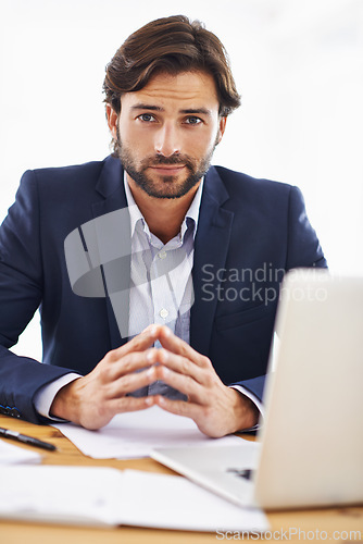 Image of Investor, portrait and businessman on laptop in office with project and research on stocks. Investment, review and planning on computer with email, communication or analysis of information on website