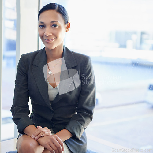 Image of African woman, portrait and sitting in lobby for corporate interview, career and office job. Female recruit, smiling and professional for business, finance work and future employee for company