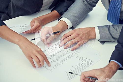 Image of Closeup, hands and business people with paperwork, finance or contract for b2b deal or economy. Brokers, manager or employee with documents or trading with stats or signing with planning or writing
