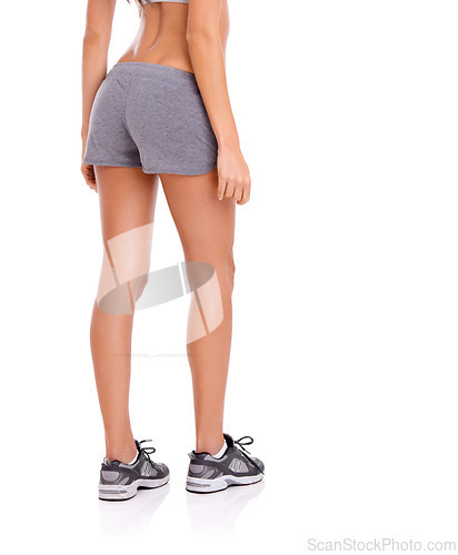 Image of Woman, athlete and legs in studio with fitness for exercise, workout and healthy body with training shoes. Model, person and rear view with sportswear or mockup space for wellness on white background