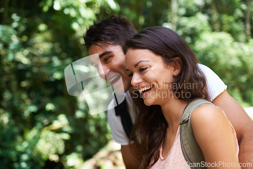 Image of Happy, hiking and couple in forest laughing for adventure, freedom and explore nature for wellness. Dating, travel and man and woman bonding for outdoor holiday, vacation and trekking for exercise