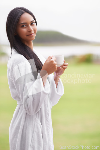 Image of Spa, coffee and portrait of woman in garden for skincare, wellness and treatment in luxury salon. Resort, happy and person for massage, therapy and cosmetics for relax, calm and self care with drink