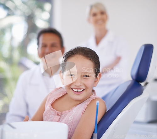 Image of Portrait, dentist and man with kid in clinic for expert advice, confidence and orthodontics in medical health. Dental medicine, healthcare and professional with girl patient, smile and oral service