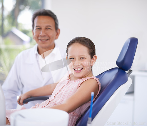 Image of Portrait, dentist and man with child in clinic for expert advice, confidence and orthodontics in medical health. Dental medicine, healthcare and professional with girl patient, smile and oral service