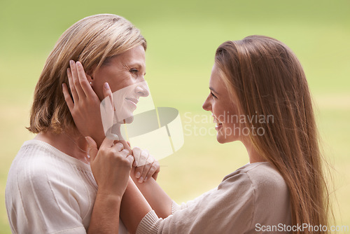 Image of Women, mother and daughter with embrace, love and mature person with connection, happy and care. Mom, girl and family with bonding, reunion and support with relationship, smile and together by grass