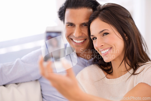 Image of Happy couple, relax and selfie on sofa for bonding, photography or picture in living room together at home. Young man or woman with smile for photo vlog, picture or social media on couch at house