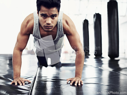 Image of Male person, pushups and training for fitness, sport and health for being a boxer on mat for muscles. Man, wellness and exercise for workout, athlete and cardio strength for commitment in boxing gym