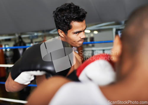 Image of Boxer, man and fight in boxing ring for training, workout and confidence for performance with coach and fitness. Professional, athlete and exercise for competition, match and sport with endurance