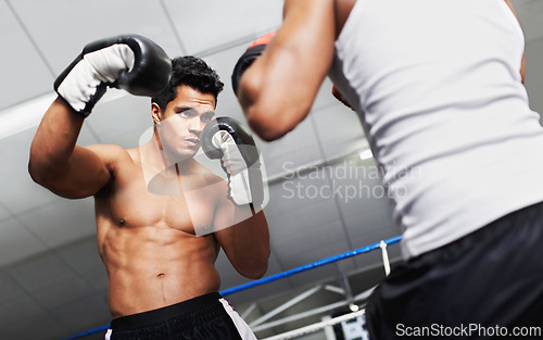 Image of Boxer, man and fight in boxing ring for practice, training or confidence for performance with coach or fitness. Professional, athlete or exercise for competition, match or sport with personal trainer