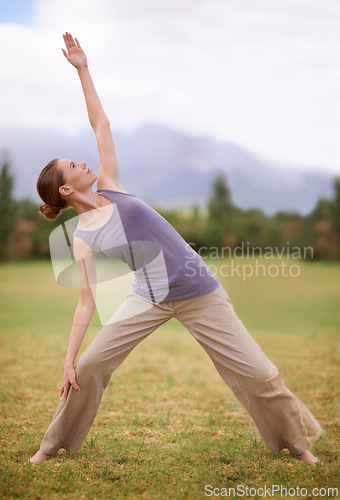 Image of Woman, yoga and pilates on field in nature for outdoor workout, exercise or health and wellness. Young female person or yogi stretching body for zen, training or balance in wellbeing on green grass