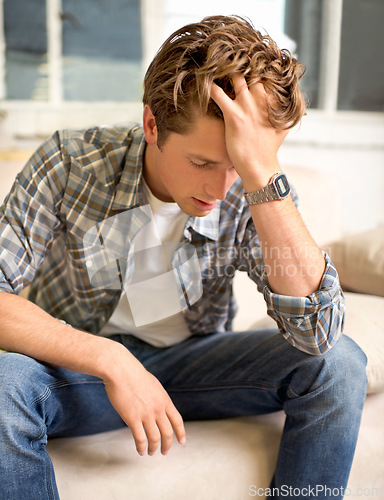 Image of Man, couch and headache pain with hand for mental health burnout or overworked or frustrated, tired or depressed. Male person, sofa and migraine with vertigo in London or stress, worry or overwhelmed