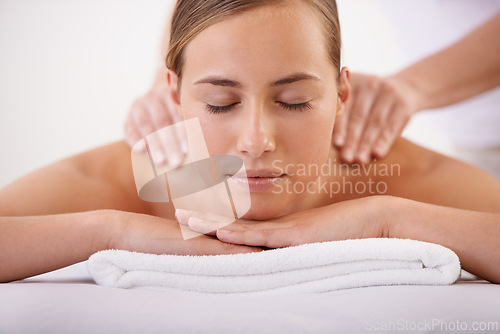 Image of Spa, face and woman or hands with massage for relax, luxury treatment and satisfaction with towel. Person, calm and masseuse for body care, pain relief and comfort with health, wellness and skincare