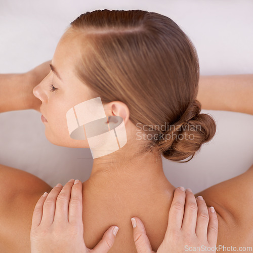 Image of Spa, top view and woman or hands with massage for relax, luxury treatment and satisfaction with towel. Person, face and masseuse for body care, pain relief and comfort with calm, wellness or skincare