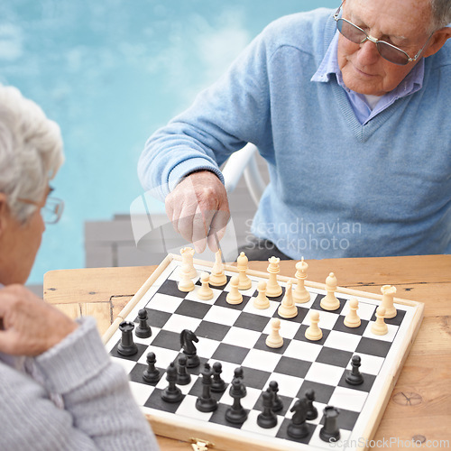 Image of Senior, couple and game of chess outdoor together in retirement with competition of strategy. Thinking, challenge and elderly man and woman with activity or contest on board for holiday or vacation