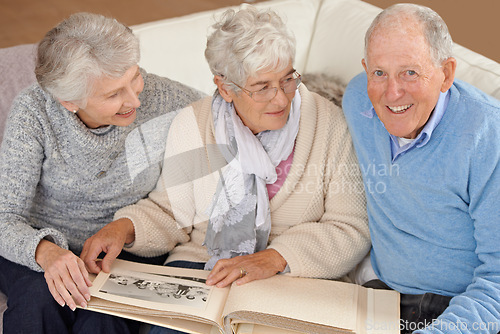 Image of Old people, friends and photo album for memory nostalgia in retirement on sofa together, photograph or connection. Elderly man, women and picture book in home in Canada for bonding, remember or love