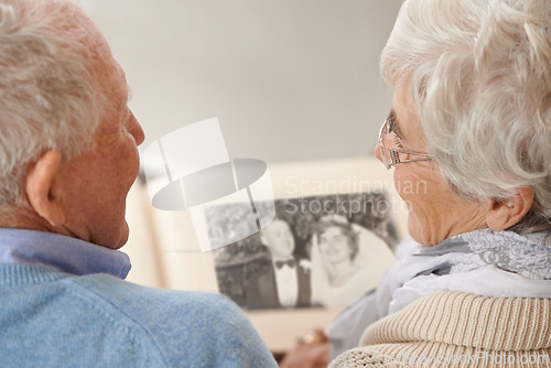 Image of Old couple, photo album and memory nostalgia to remember wedding in retirement for connection, bonding or together. Elderly man, woman and photography book for union commitment, rear view or past