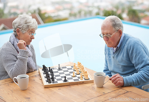 Image of Chess, game and senior couple outdoor together in retirement to relax with competition of strategy. Thinking, challenge and elderly man and woman with activity on board for holiday or vacation