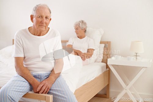 Image of Senior, couple and stress in bedroom with conflict, ignore and crisis in marriage for mental health and retirement. Elderly, woman or man with fight, sad and divorce on bed in home with disagreement