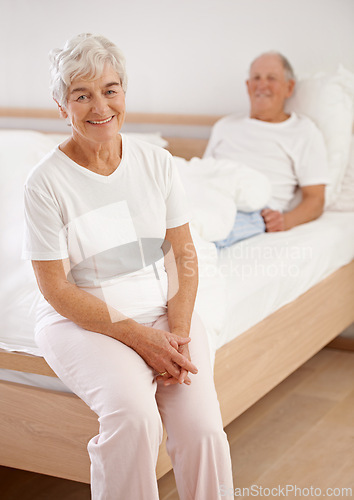 Image of Senior, couple and portrait or happy in bedroom for relax, retirement and pyjamas in hotel in the morning. Elderly, man and woman on bed with face, smile and hospitality in resort or accommodation