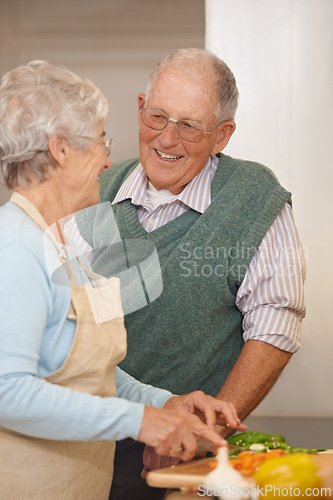 Image of Senior couple, cutting vegetables and laughing in kitchen, food preparation and love at home. Elderly people, healthy meal and organic ingredients for nutrition, funny conversation and retirement