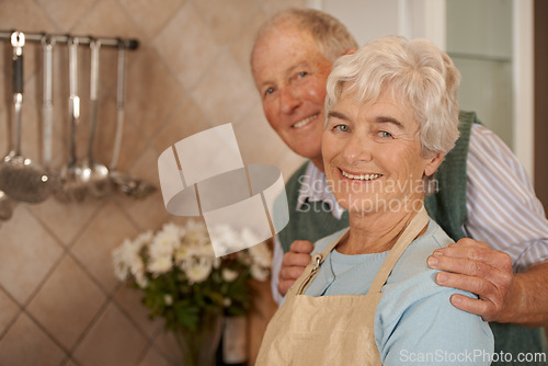 Image of Couple, elderly and portrait with smile in kitchen for love, bonding and cooking together in home for anniversary. Happy, man and woman in house for commitment, retirement and dinner for enjoyment