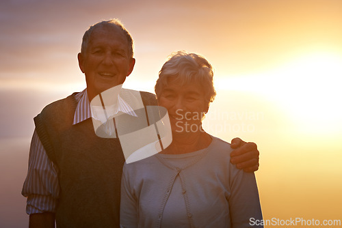 Image of Portrait, smile and senior couple at sunset for love, romance or retirement bonding outdoor together. Face, autumn or evening with happy elderly man and woman hugging for anniversary or commitment