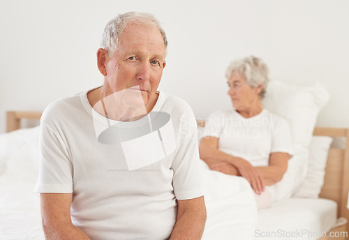 Image of Elderly, couple and sad in bedroom with conflict, ignore and crisis in marriage for mental health or retirement. Senior, woman or man with fight, argument or divorce on bed in home with disagreement