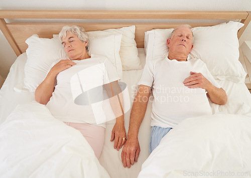 Image of Sleeping, love and senior couple in bed, resting and relaxing together on weekend in bedroom. Elderly people, retirement and dreaming at home, top view and support in marriage or relationship and nap