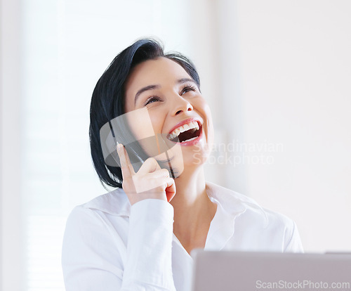 Image of Woman, business and laughing with laptop, phone call and conversation while working as Administrative Assistant. Female person, employee and cellphone for communication, career and happiness with pc