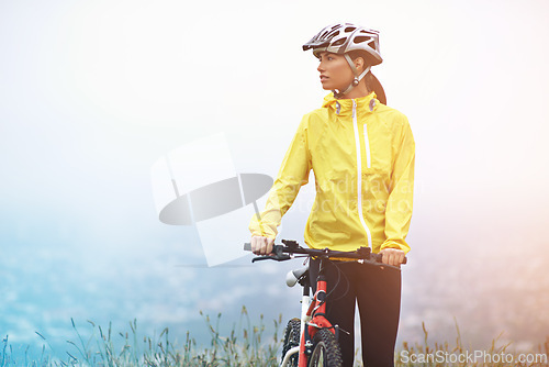 Image of Thinking, sports and woman with bike in mountains for morning exercise, training or off road hobby. Cycling, fitness and idea with confident young athlete in countryside or nature for workout ride