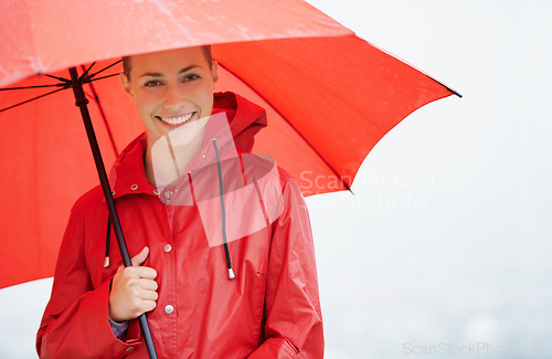 Image of Woman, portrait and umbrella for insurance, outdoor nature and protection from rain in cold weather. Female person, secure and safety or shield from storm, winter and travel to Scotland for holiday