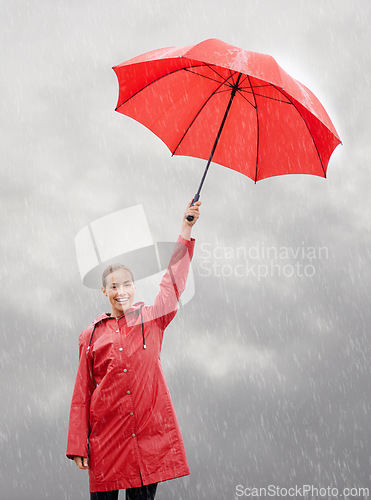 Image of Woman, portrait and umbrella for security, storm and protection from rain in weather. Female person, insurance and safety or shield from rainfall in outdoor, winter and travel to Scotland for holiday