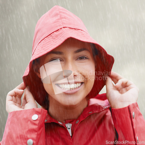 Image of Woman, portrait and raincoat for protection, outdoor nature and waterproof jacket for rain in weather. Female person, happy and safety or shield from cold, winter and travel to Scotland for holiday