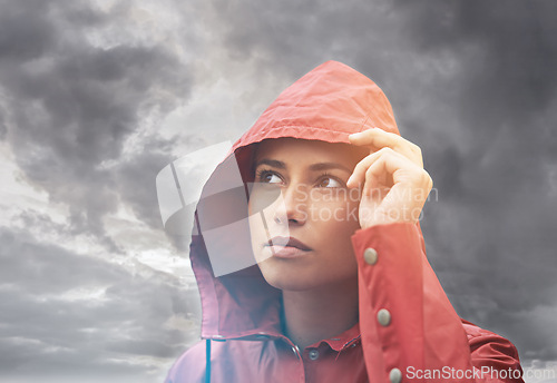 Image of Rain coat, woman and clouds with weather, outdoor and freedom with break and traveling. Person, winter or girl with cover or carefree with overcast and storm with fog or wet with water and nature