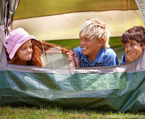 Image of Kids, camp and outdoors for tent, friends and nature on summer vacation with boys pulling person hair. Children, annoyed girl and holiday for adventure, tease and camping in backyard and on grass