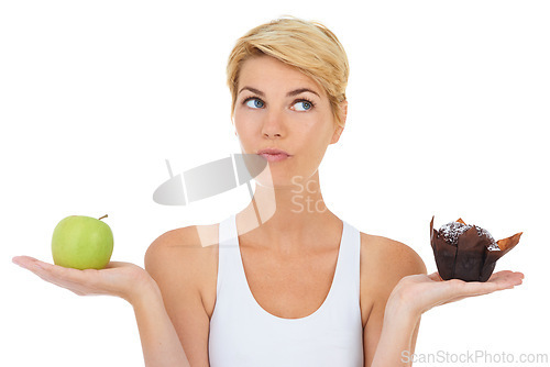 Image of Woman, fitness and health for diet option, nutrition and decision by studio for lifestyle. Female person, athlete and decide for food, workout and white background with apple and cake choice