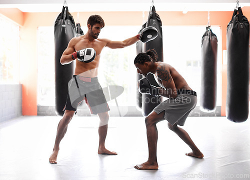 Image of Men, boxing and competition with punch for fight practice for endurance challenge, champion or winner. Male people, gloves and cardio fitness with strength for battle professional, athlete or sport