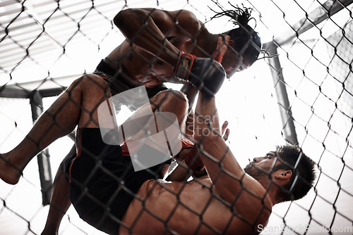 Image of Punch, cage and men sparring for kickboxing competition, challenge and fitness with fight sports in gym. Boxing match, strong fighter and knockout with exercise, practice and power in battle together