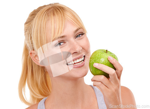 Image of Smile, studio and portrait of woman with apple for vegan, diet and nutrition benefits for wellness. Food, face and happy person with fruit for vitamin c, detox and gut health on white background