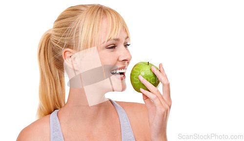 Image of Face, smile and woman with apple for diet, benefits or food to lose weight in studio. Healthy eating, nutrition and happy girl with fruit for body wellness, digestion and thinking on white background