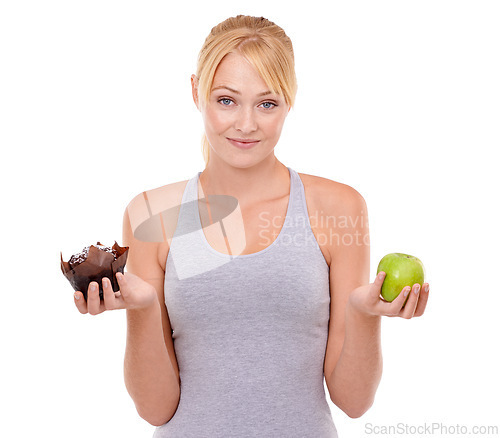 Image of Portrait, doubt and woman with choice of cake, apple or healthy eating food to lose weight in studio. Benefits, face and girl with fruit vs dessert, decision for diet or nutrition on white background